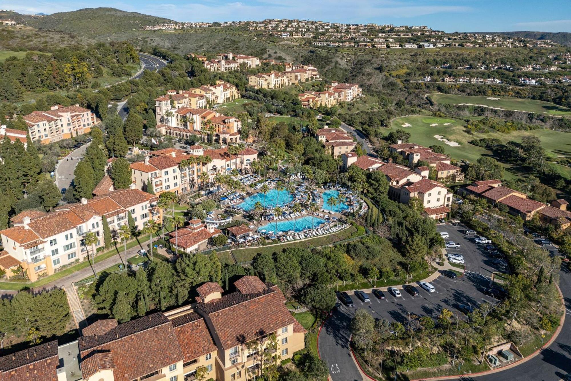 Aerial view of luxury villas in Newport Coast highlighting top real estate agent properties.